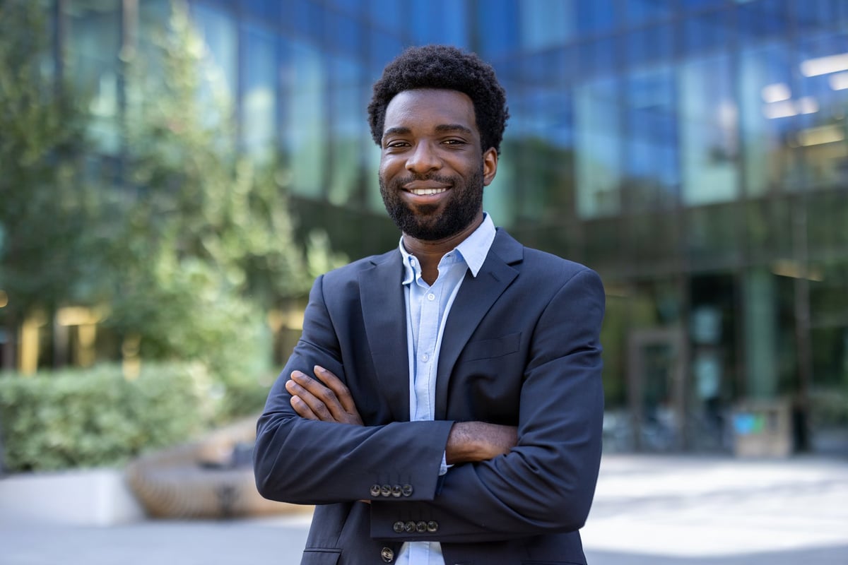 Portrait of successful confident businessman African American company employee