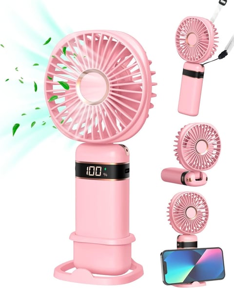 Pink portable fan with digital display shown in multiple configurations including tabletop, handheld, and phone mount options with green wind effect illustration