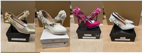 Four decorative womens heels and wedges in various colors and embellished styles displayed on black and white platforms